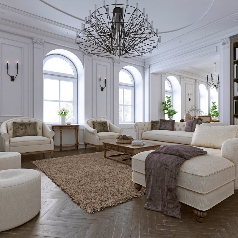 Luxurious living room with white furniture, a chandelier, and decorative elements.